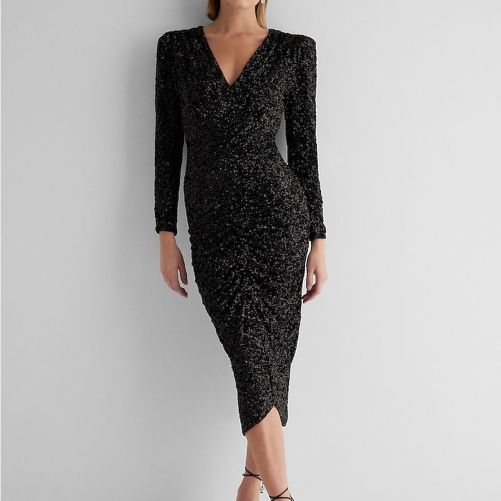 - sequin dress. Ruched , v neck puff shoulder. Black statement dress